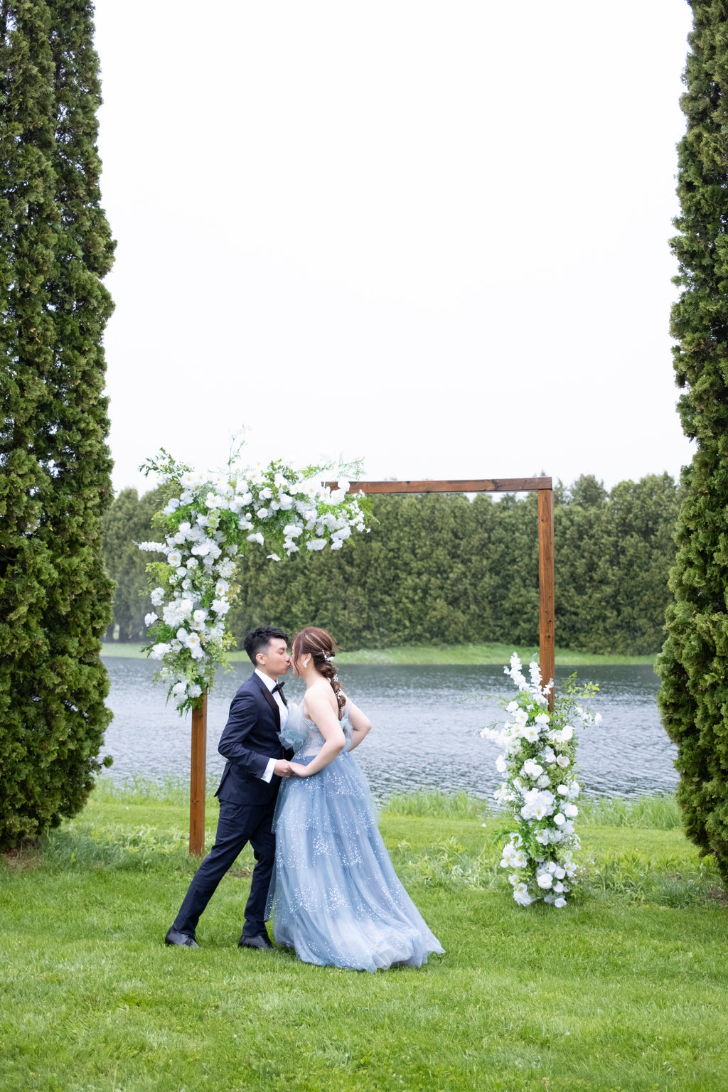 White & Green Ceremony with Wooden Arch